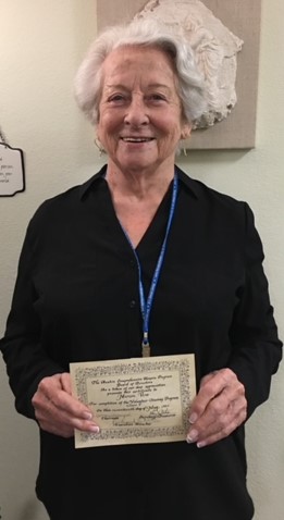 Marion Vise with her volunteer certificate from 1983. She's a 2023 Lifetime Achievement Awardee!